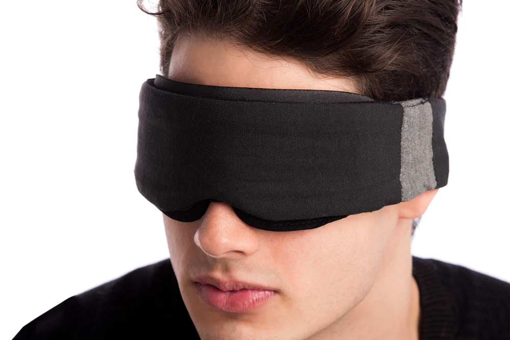 Man on Angle Wearing Low-Profile Contoured Blackout Sleep Mask